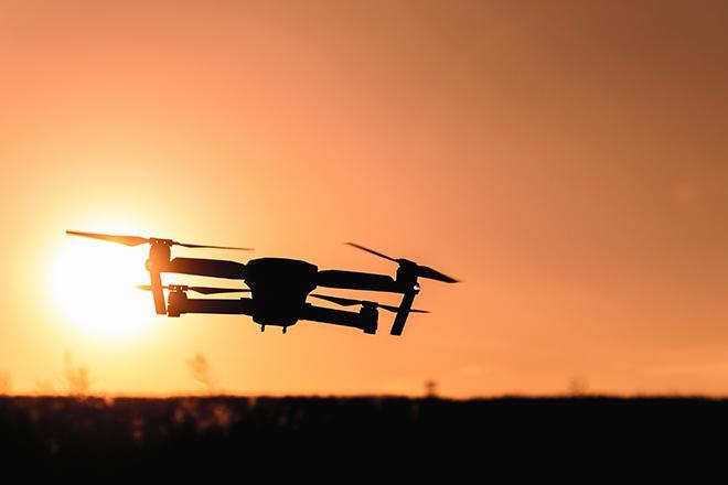 drone flying at sunrise